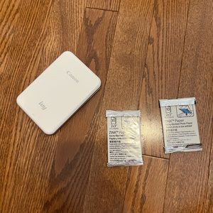 Cannon mini printer and two packs of film.